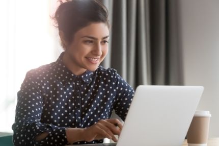 Female student on laptop at home