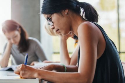 Female student studying in classroom