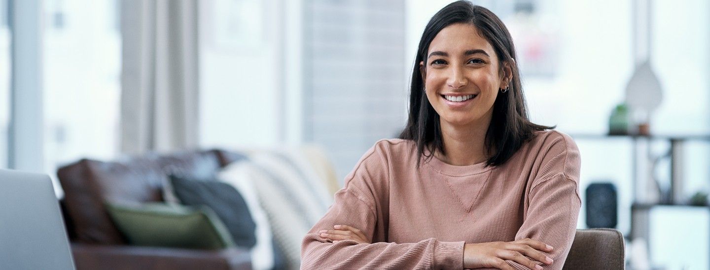 Happy woman studying at home