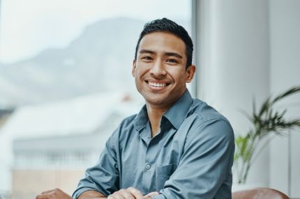 Man smiling working in office