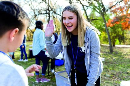 Students highfiving