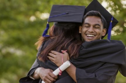 Students hugging at graduation