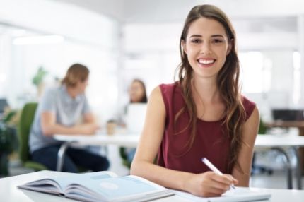 Woman happy studying on campus